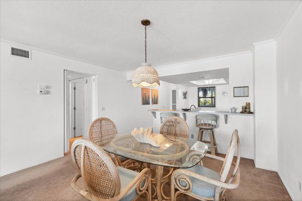 Dining table seats 4 with 2 more seats at kitchen bar