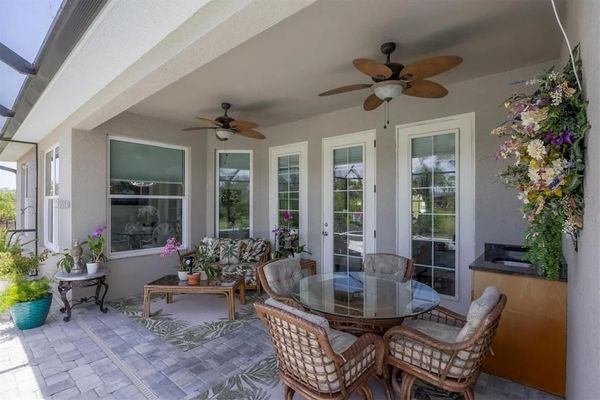 Relaxing outdoor living space overlooking the sparkling pool