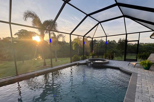 Sparkling pool & spa overlooking canal. Pool size: 22' x 14' x 6'. Spa seats 6