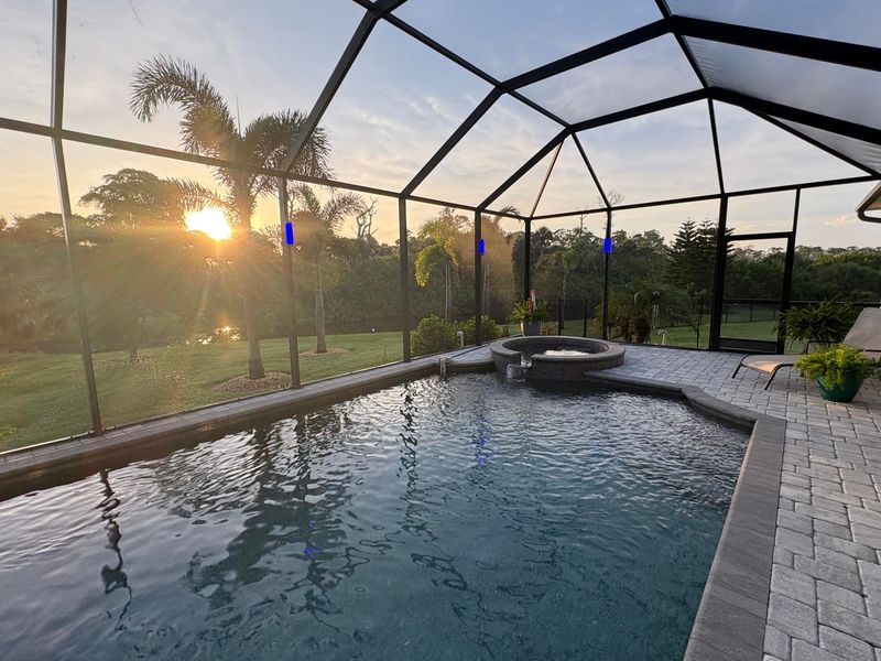 Sparkling pool & spa overlooking canal. Pool size: 22' x 14' x 6'. Spa seats 6