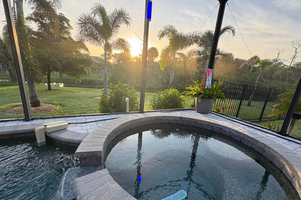 Sparkling pool & spa overlooking canal. Pool size: 22' x 14' x 6'. Spa seats 6