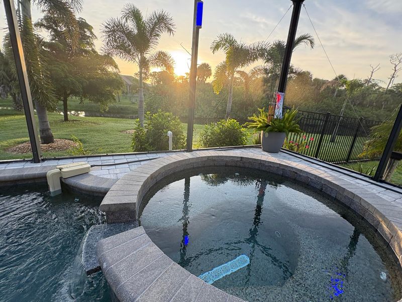 Sparkling pool & spa overlooking canal. Pool size: 22' x 14' x 6'. Spa seats 6
