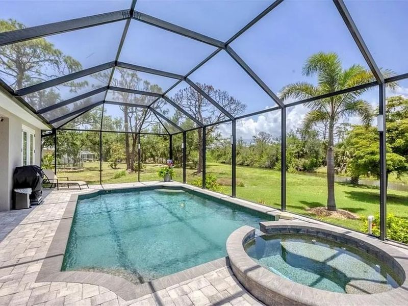 Sparkling pool & spa overlooking canal. Pool size: 22' x 14' x 6'. Spa seats 6