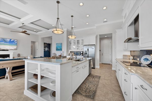 Gorgeous, fully-equipped kitchen over looking the living room and dining areas
