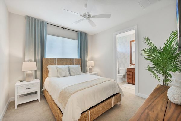 Guest bedroom 3 with queen bed, attached bathroom, and 43-inch Smart TV