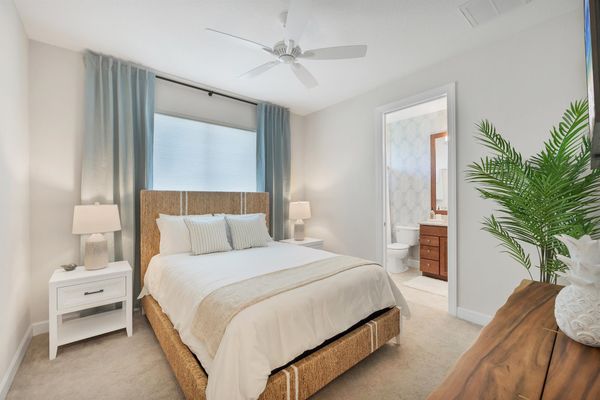 Guest bedroom 3 with queen bed, attached bathroom, and 43-inch Smart TV