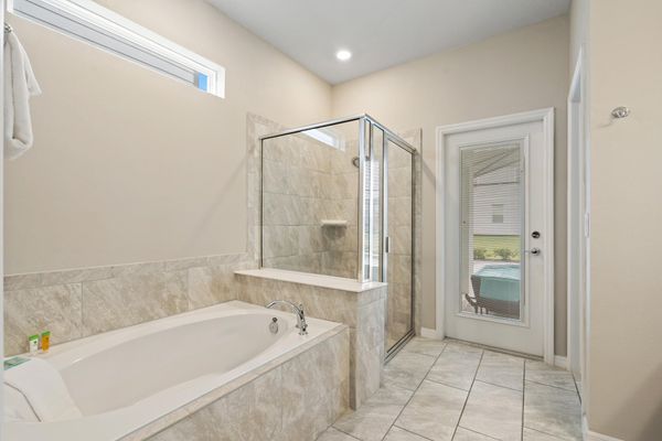 Master King Bathroom 1 Downstairs Tub & Shower Door to Pool