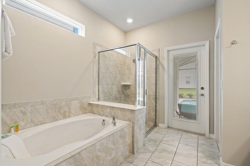 Master King Bathroom 1 Downstairs Tub & Shower Door to Pool