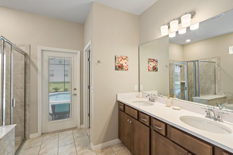 Master King Bathroom 1  Downstairs Tub & Shower Door to Pool