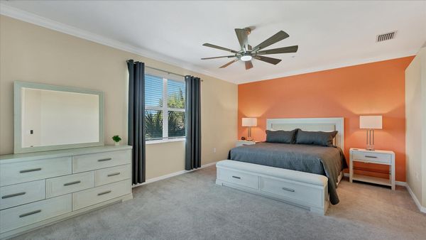 Primary bedroom with king bed and attached bathroom