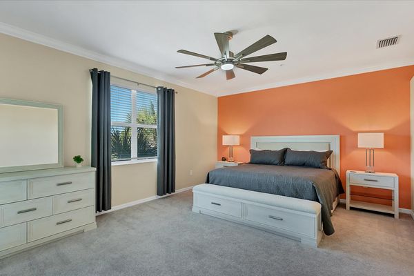 Primary bedroom with king bed and attached bathroom