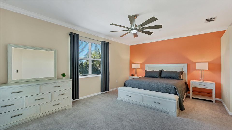 Primary bedroom with king bed and attached bathroom
