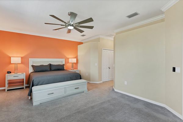 Primary bedroom with king bed and attached bathroom