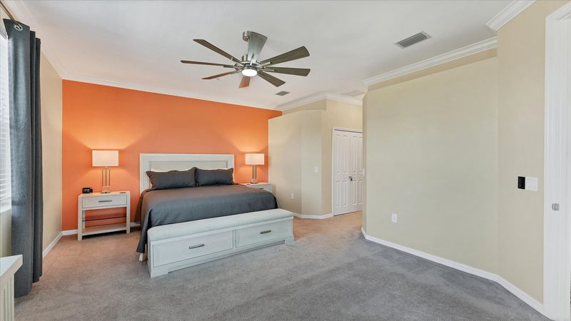 Primary bedroom with king bed and attached bathroom