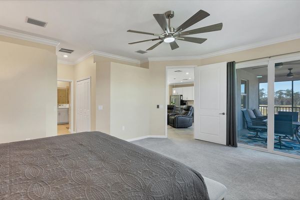 Primary bedroom with king bed and attached bathroom