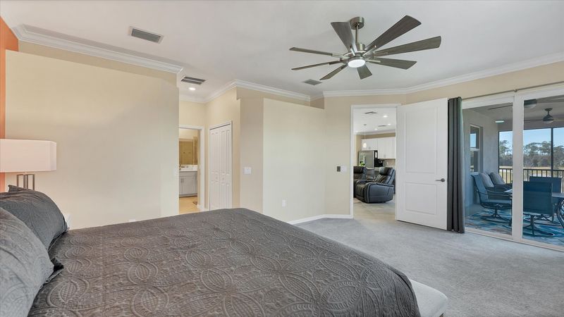 Primary bedroom with king bed and attached bathroom