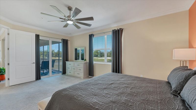 Primary bedroom with king bed and attached bathroom