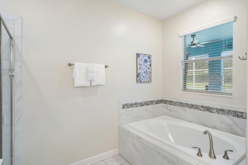 Master King Bathroom 1 Downstairs Tub & Shower Door to Pool