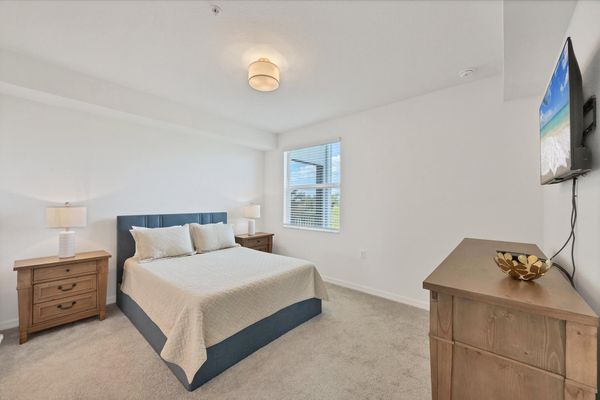 Primary bedroom with queen bed, en suite and 43-inch Smart TV