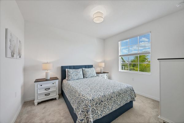 Guest bedroom 1 with queen bed and 43-inch Smart TV