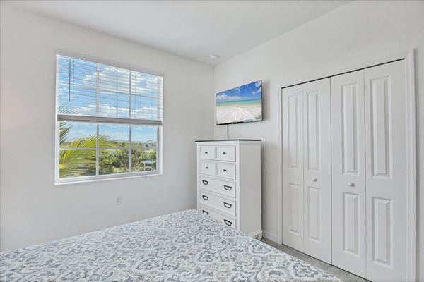 Guest bedroom 1 with queen bed and 43-inch Smart TV
