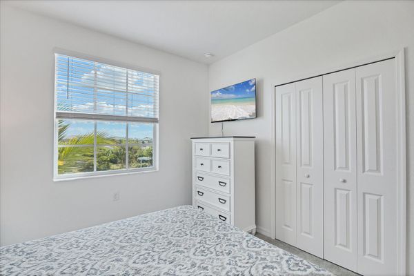 Guest bedroom 1 with queen bed and 43-inch Smart TV