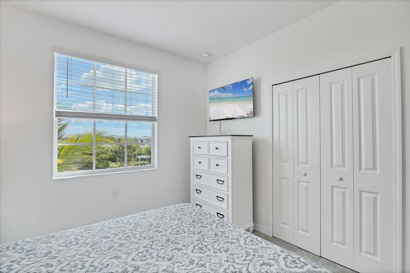 Guest bedroom 1 with queen bed and 43-inch Smart TV