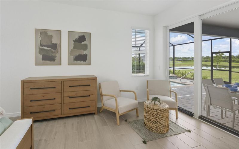 Primary bedroom with king bed, attached bathroom, lanai access, and 65-inch Smart TV