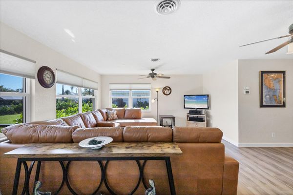 Bright, open living space. Livingroom features large sectional sofa and 50-inch Smart TV
