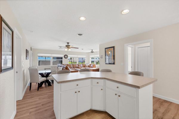 Fully-equipped kitchen overlooking the dining room and living room. Dining table seats 4 with an additional 4 at the kitchen island