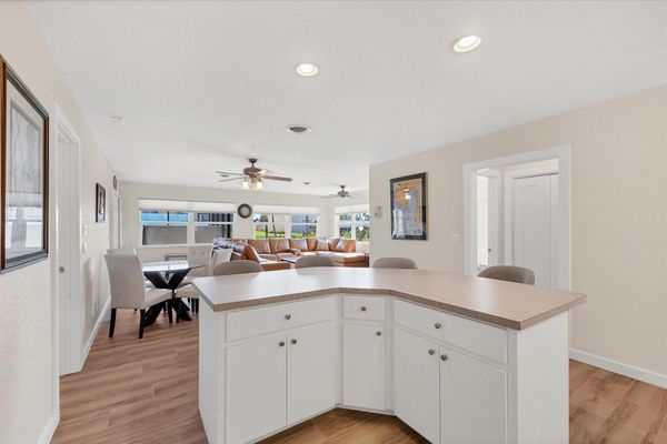 Fully-equipped kitchen overlooking the dining room and living room. Dining table seats 4 with an additional 4 at the kitchen island