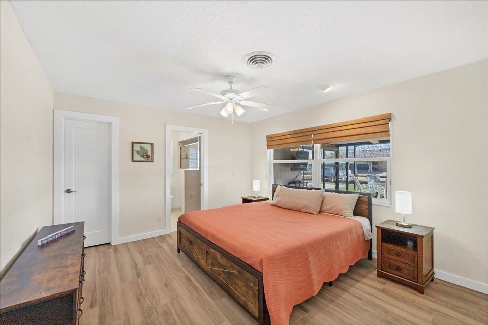 Primary bedroom with king bed, and attached bathroom