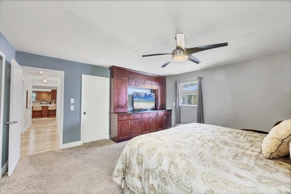 Primary bedroom features a queen bed, en suite, and 50-inch Smart TV