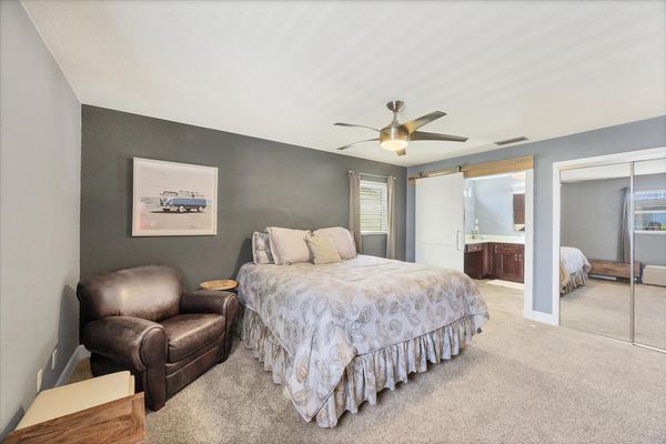 Primary bedroom features a queen bed, en suite, and 50-inch Smart TV