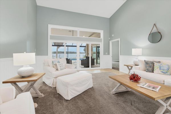 Living room overlooking the sparkling pool
