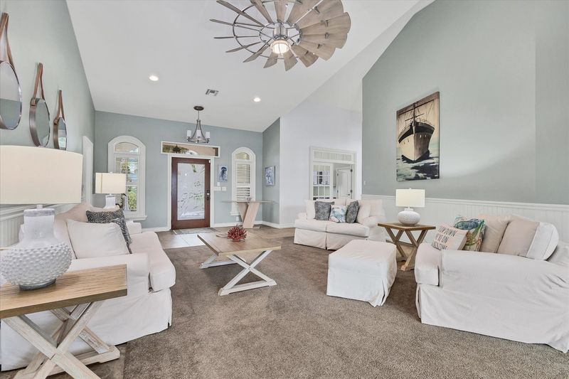 Living room overlooking the sparkling pool