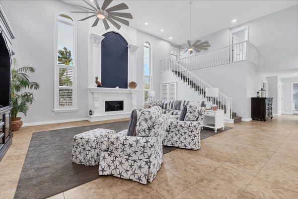 Large, open living space with ample seating, fireplace and 70-inch Smart TV