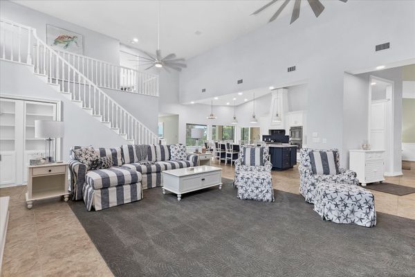 Large, open living space with ample seating, fireplace and 70-inch Smart TV