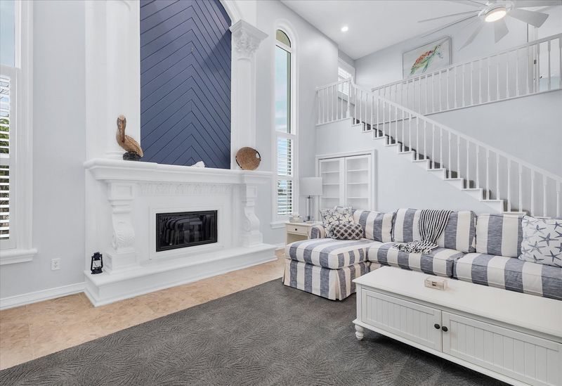 Large, open living space with ample seating, fireplace and 70-inch Smart TV