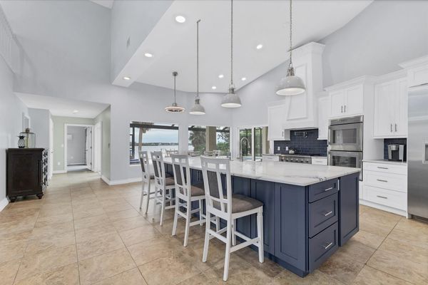 Gorgeous, fully-equipped kitchen features high-end stainless-steel appliances, and plenty of storage and counter top space
