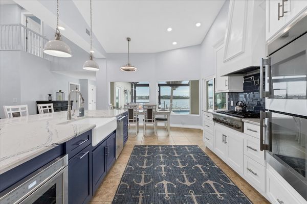 Gorgeous, fully-equipped kitchen features high-end stainless-steel appliances, and plenty of storage and counter top space