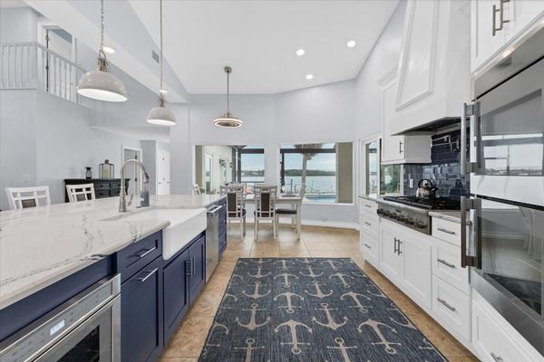 Gorgeous, fully-equipped kitchen features high-end stainless-steel appliances, and plenty of storage and counter top space