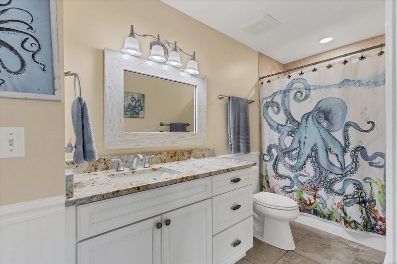 Attached bathroom with shower/tub combo