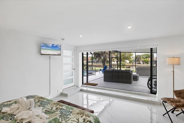 King suite with one king bed, attached bathroom, lanai access, and 32-inch Smart TV