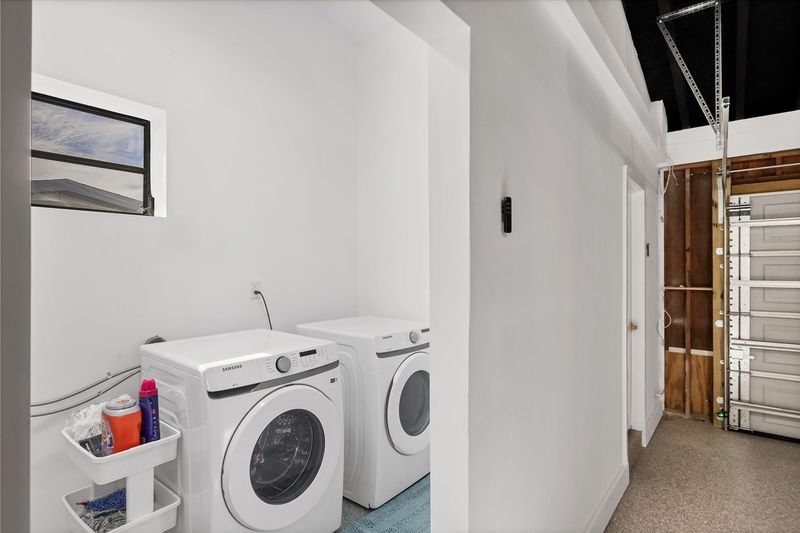 Laundry off of garage with full-size washer & dryer