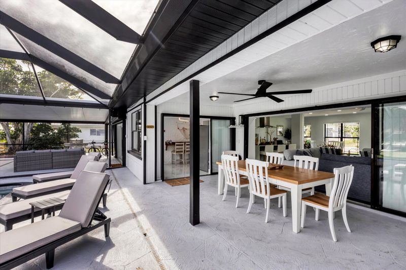 Extra large lanai overlooking the canal. Includes sparkling pool, relaxing hot tub, al fresco dining and more. Pool size: 14' x 28' x 6'