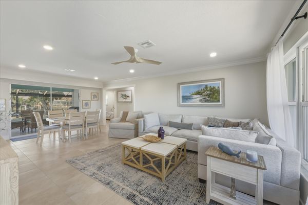 Open living space features lots of comfy seating and 65-inch Smart TV