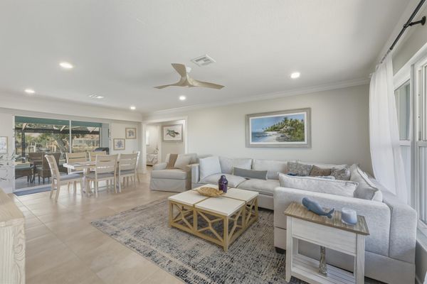 Open living space features lots of comfy seating and 65-inch Smart TV