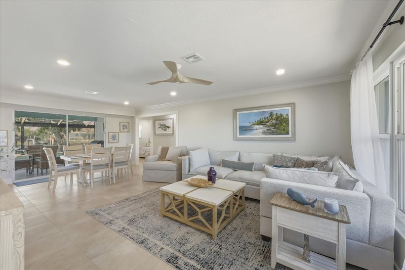 Open living space features lots of comfy seating and 65-inch Smart TV