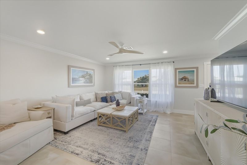 Open living space features lots of comfy seating and 65-inch Smart TV